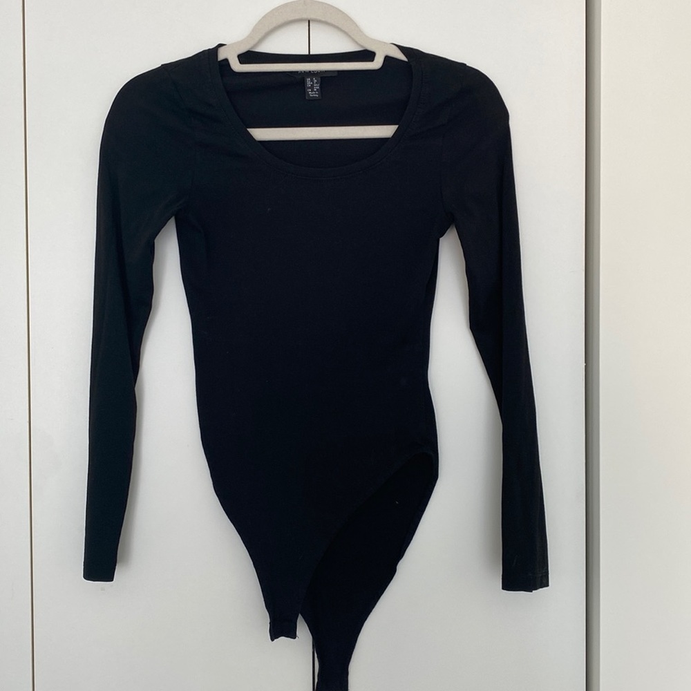 Basic black long sleeve body suit. Scoop neck. Size 4.